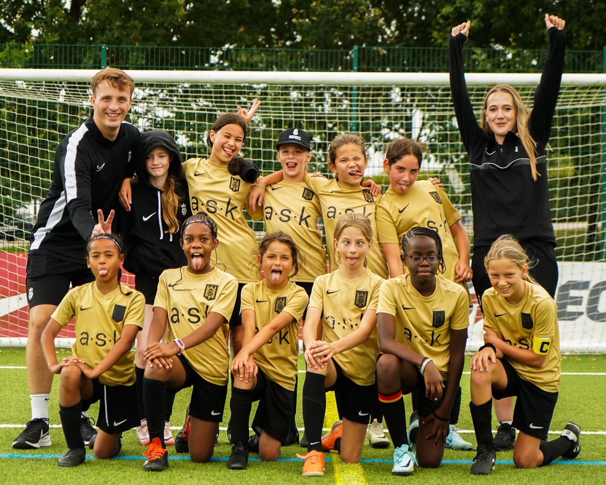 Bloomsbury Football Academy girls team smile together