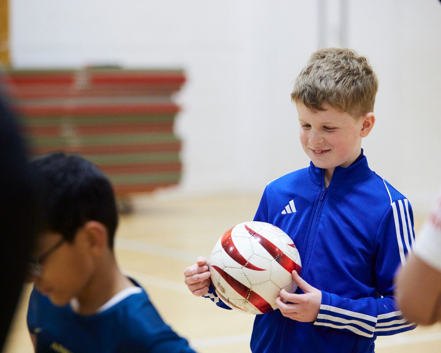 Bloomsbury Football Foundation blind football player holding a sound ball
